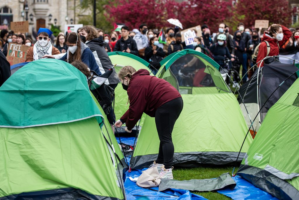 Protesters pitch tents during a pro-Palestinian protest Monday, April 29, 2024, at the University of Wisconsin-Madison in Madison, Wis. Angela Major/WPR