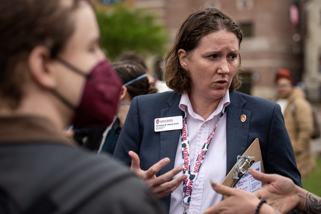 UW-Madison Dean of Students Christina Olstad speaks with organizers and campus police after pro-Palestinian protesters set up camp in the Library Mall on Monday, April 29, 2024, at the University of Wisconsin-Madison in Madison, Wis. Angela Major/WPR
