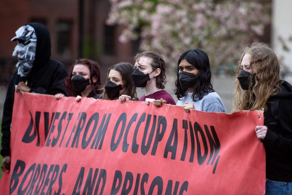 Pro-Palestinian protesters hold a banner in the Library Mall on Monday, April 29, 2024, at the University of Wisconsin-Madison in Madison, Wis. Angela Major/WPR