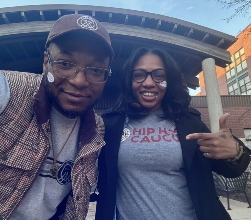 Moments after voting for the first time, Andron Lane (left) celebrates with his friend and co-worker Gabi Hart, each wearing an “I Voted” sticker on their face. (Photo provided by Andron Lane)