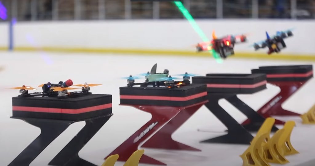 Drones taking off. Screenshot from Milwaukee Montessori School Ice Storm Drone Racing Competition video.