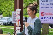 Brooke Legler, a child care provider and advocate, addresses a rally in New Glarus to call for public investment in child care. (Erik Gunn | Wisconsin Examiner)