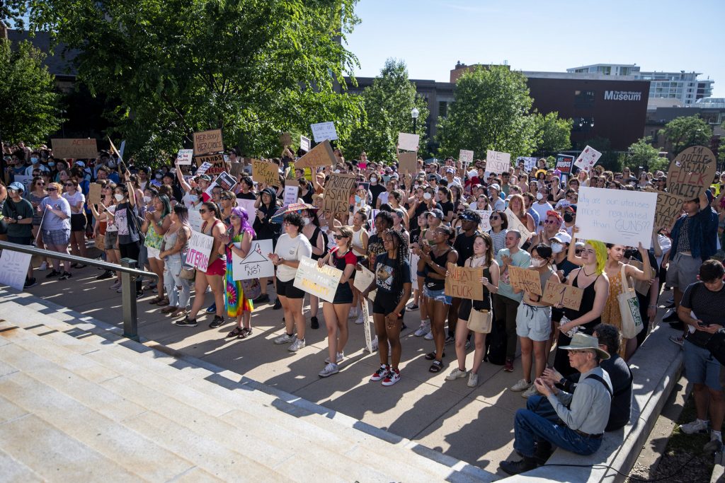 Protesters stand together as they listen to speakers discuss abortion access Friday, June 24, 2022, in Madison, Wis. Angela Major/WPR
