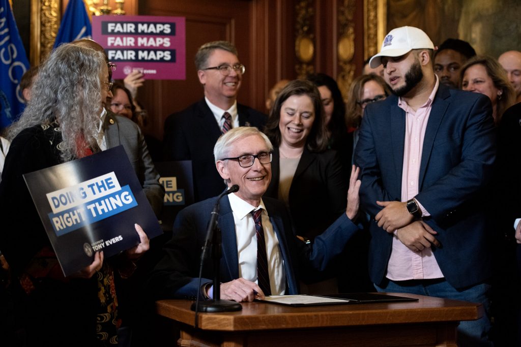 Gov. Tony Evers signs the bill Monday, Feb. 19, 2024, at the Wisconsin State Capitol in Madison, Wis. Angela Major/WPR