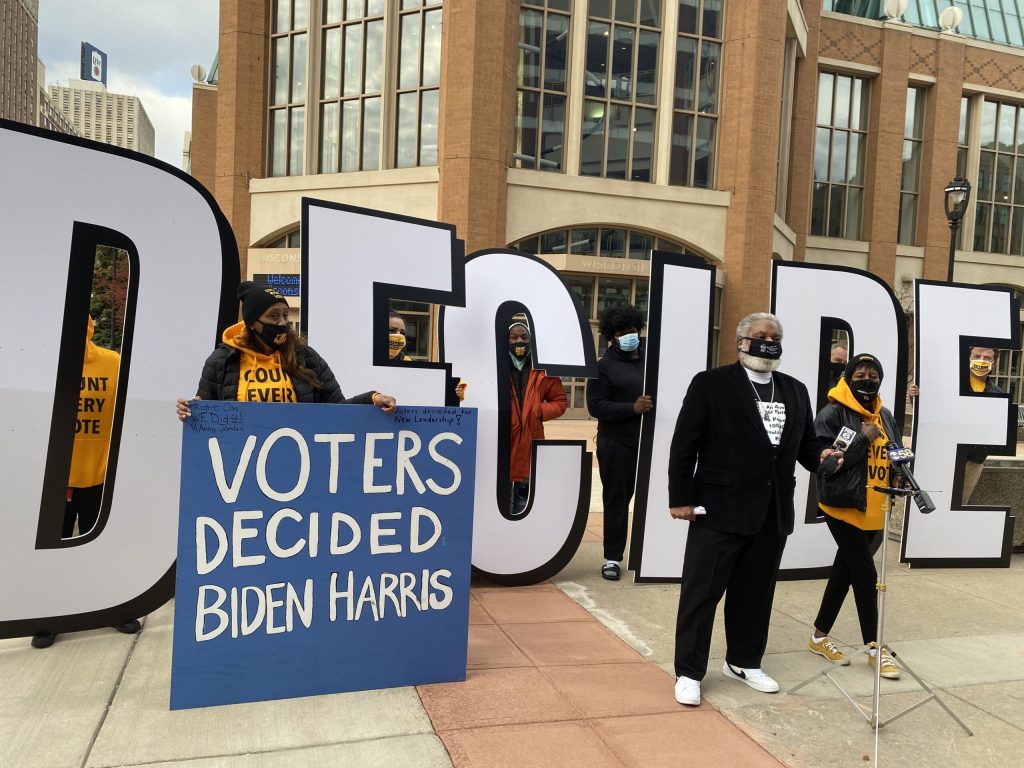 Before the recount in Milwaukee County began Friday morning, protesters from Souls to the Polls and the Service Employees International Union (SEIU) said Donald Trump should be focused on the pandemic, instead of recounting votes. Corrine Hess/WPR  