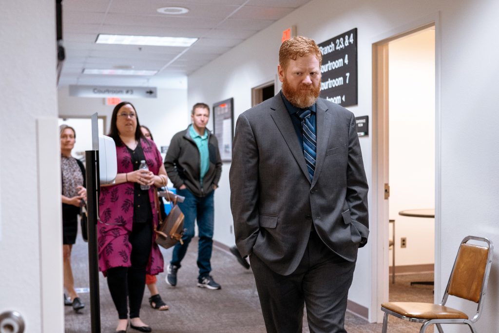 Former Appleton Police Officer Jeremy Haney, right, arrives at the Outagamie County courthouse prior to his plea and sentencing hearing on April 30, 2024. Haney’s charges resulted from forging a search warrant while investigating a suspected drug dealer. (Shane Fitzsimmons for Wisconsin Watch)