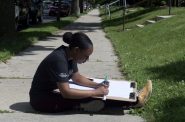 Architecture and planning researcher Teonna Cooksey sketches the floorplan of a north side Milwaukee house as part of field work for the University of Wisconsin-Milwaukee. Photo courtesy UW-Milwaukee