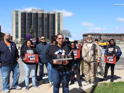 Activists Demand Robert Spindell’s Removal From Elections Commission