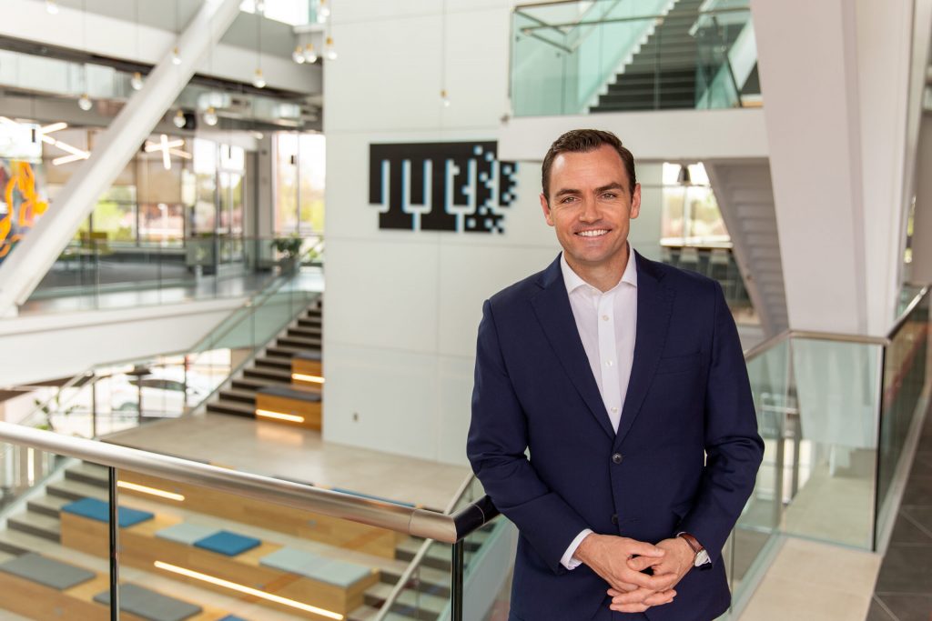 Former Republican Congressman Mike Gallagher smiles inside TitletownTech’s Ashwaubenon headquarters. Gallagher has been as an advisor by the capital firm. (Photo Courtesy of TitletownTech.