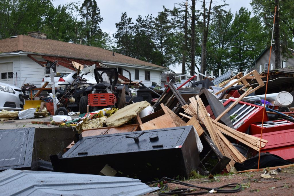 A home’s garage was destroyed in the storms Tuesday night in Unity, Wis. On Wednesday, crews were cleaning up downed trees and other debris. Rob Mentzer/WPR