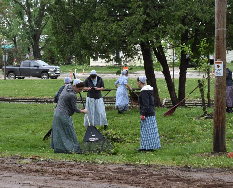 A team of women work on cleanup from tornado damage in Unity, Wis., May 22, 2024. Rob Mentzer/WPR