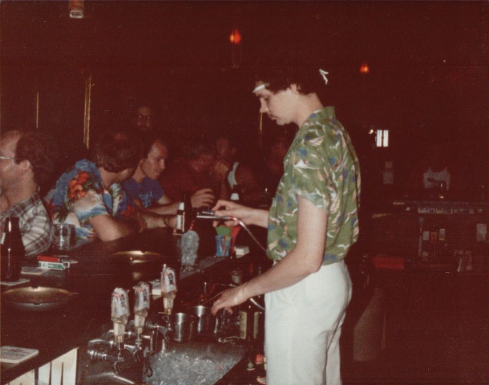A bartender makes drinks at This is It! bar in Milwaukee. Thousands of photos of the city’s first gay bar were recently donated to the Wisconsin LGBTQ History Project for preservation. Photo courtesy of the Wisconsin LGBTQ History Project