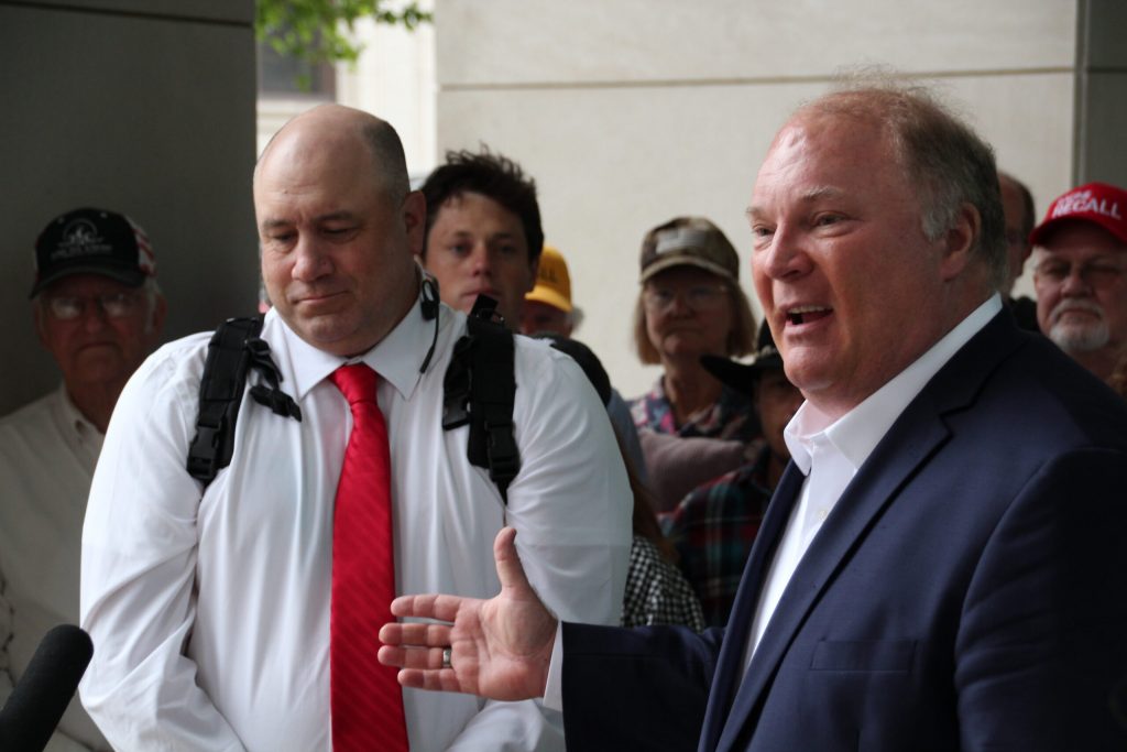 Former Supreme Court Justice Michael Gableman speaks outside the Wisconsin Elections Commission offices in Madison in support of an effort to recall Assembly Speaker Robin Vos. Recall organizer Matthew Snorek, left, said organizers turned in more than 9,000 signatures. Shawn Johnson/WPR