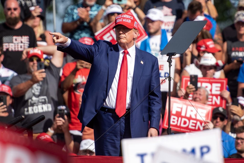 Former President Donald Trump points at supporters after speaking at a rally Tuesday, June 18, 2024, in Racine, Wis. Angela Major/WPR