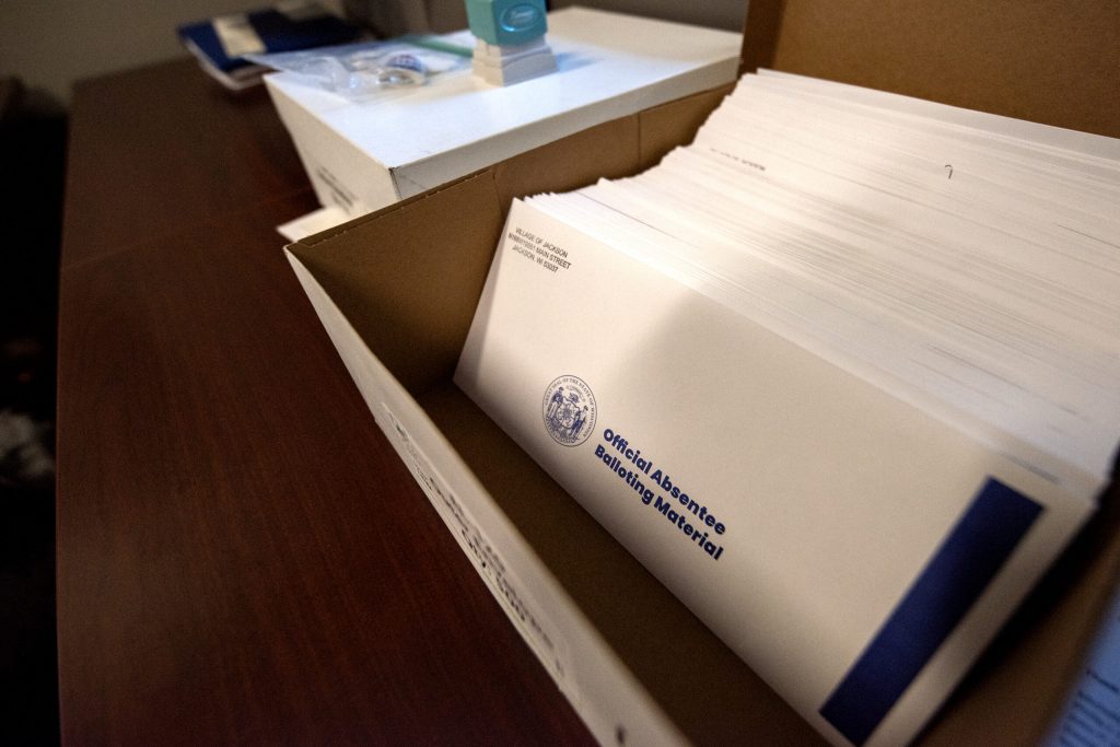 A stack of absentee ballot envelopes are kept in village clerk Anastasia Gonstead’s office Monday, June 24, 2024, in the village of Jackson, Wis. Angela Major/WPR