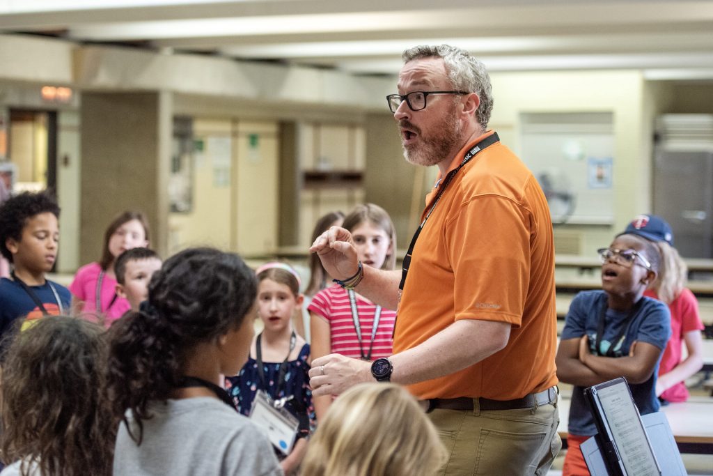 John Bragle, senior director of education for the Wisconsin Conservatory of Music, instructs students Thursday, June 27, 2024, at Henry David Thoreau Elementary School in Milwaukee, Wis. Angela Major/WPR