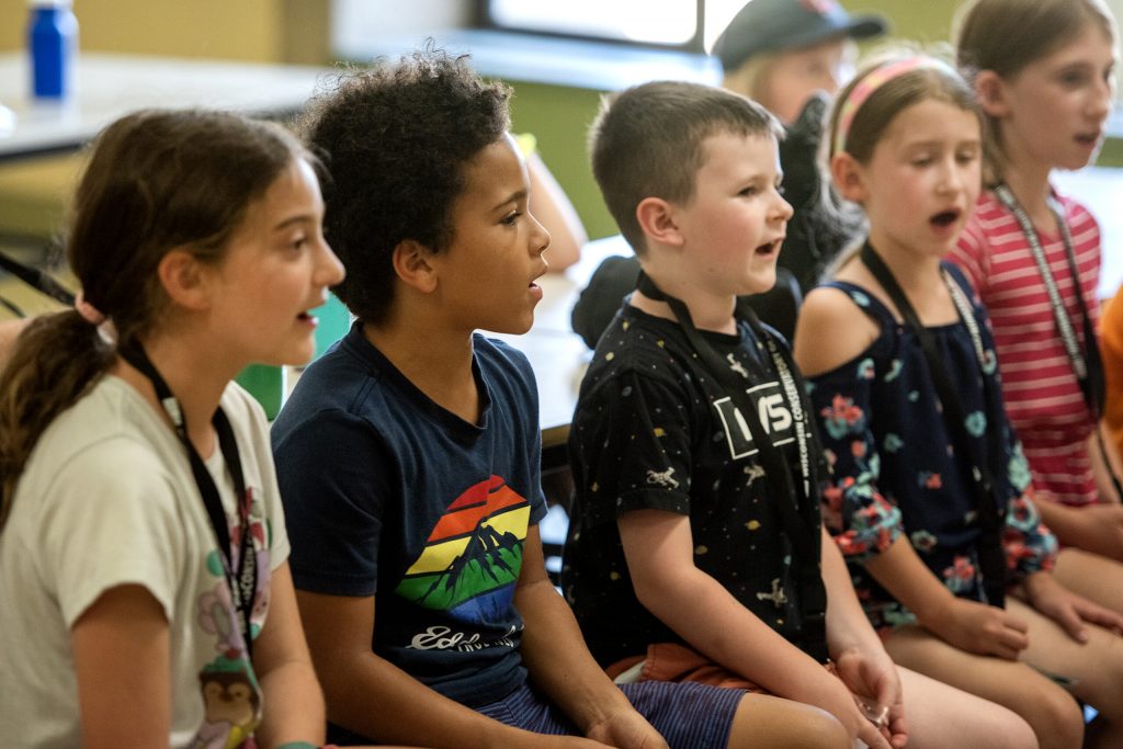 Students sing together during choir practice Thursday, June 27, 2024, at Henry David Thoreau Elementary School in Milwaukee, Wis. Angela Major/WPR