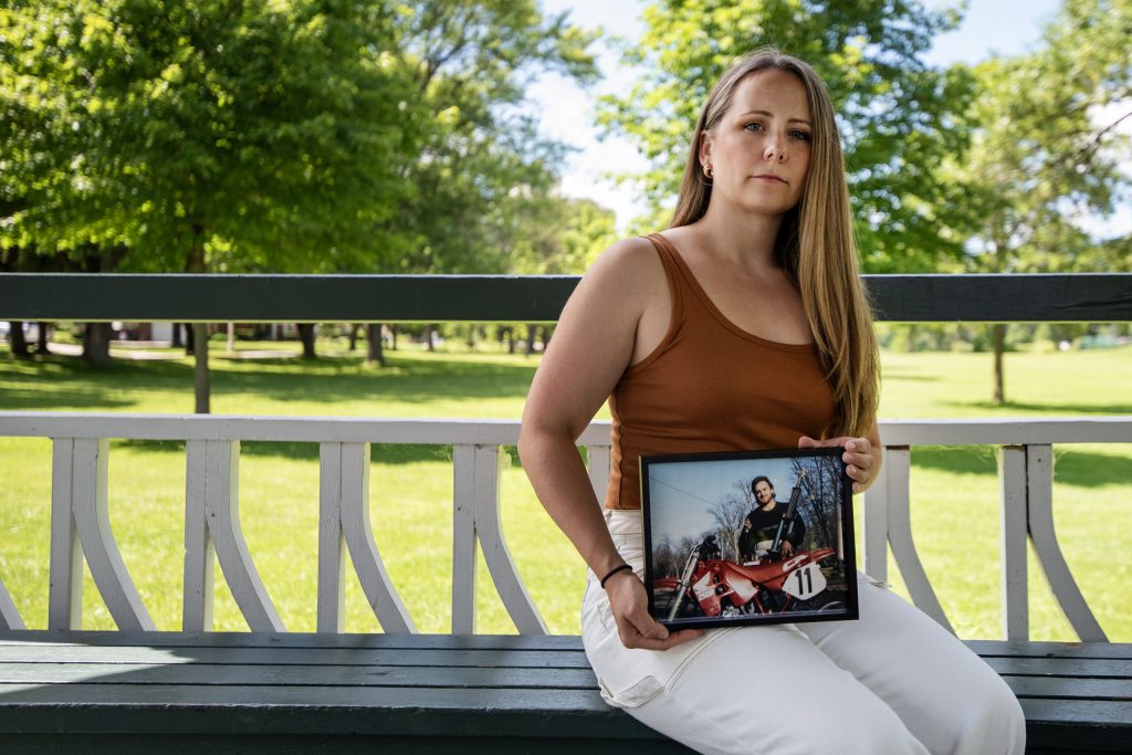 Megan Hoffmann Kolb, daughter of Dean Hoffmann, who was found dead by suicide a year ago, holds a photograph of her father Wednesday, July 3, 2024, in Cedarburg, Wis. Angela Major/WPR