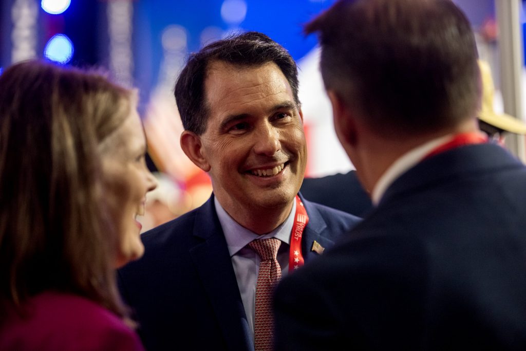 Former Wisconsin Governor Scott Walker mingles at the RNC on Monday, July 15, 2024, at the Fiserv Forum in Milwaukee, Wis. Angela Major/WPR