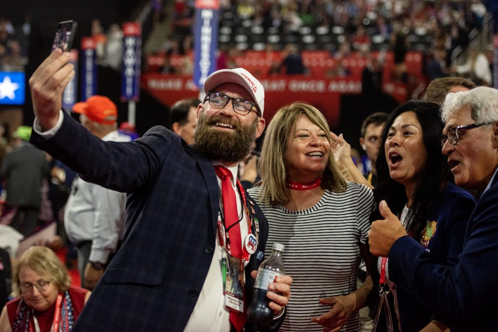RNC attendees take a selfie Monday, July 15, 2024, at the Fiserv Forum in Milwaukee, Wis. Angela Major/WPR