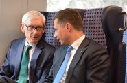 Governor Tony Evers and U.S. Transportation Secretary Pete Buttigieg ride the Amtrak Hiawatha. Photo by Jeramey Jannene.