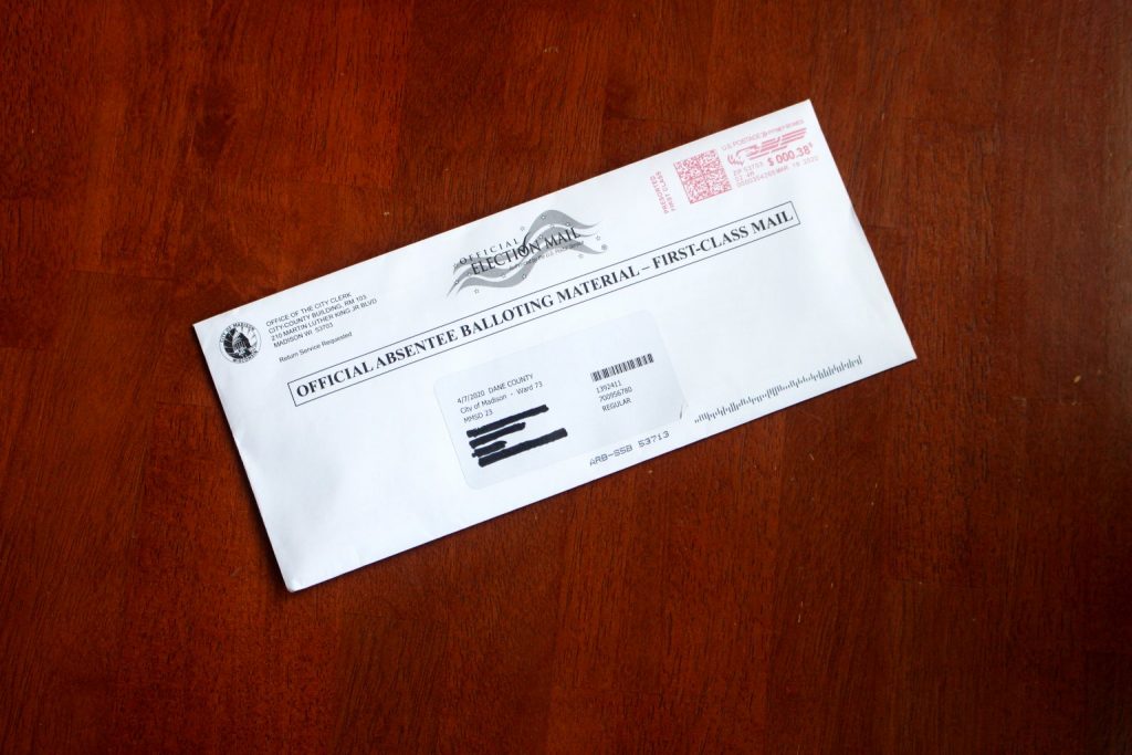 An absentee ballots for the April 7 election. (Photo by Henry Redman)