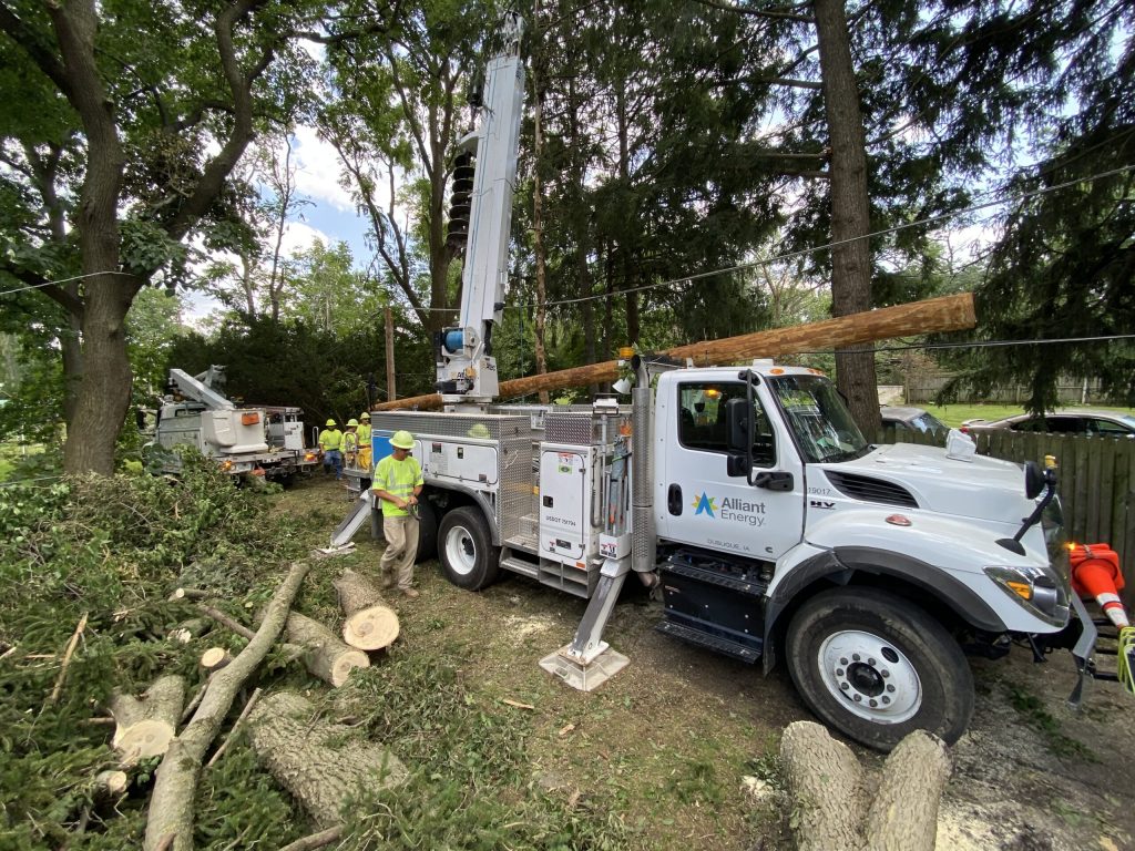 Alliant Energy employees help remove fallen trees after an outage in northern Illinois this past weekend after after at least 25 confirmed tornadoes hit Chicago and surrounding areas last week. Photo courtesy of Alliant Energy