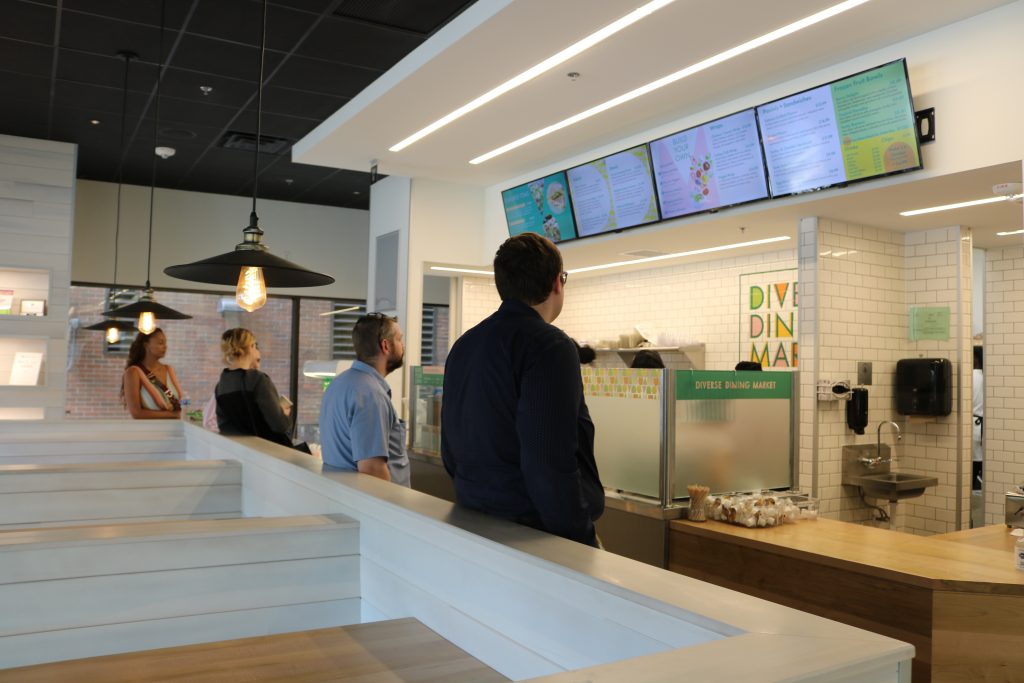 Customers wait in line at Diverse Dining Market, 250 E. Wisconsin Ave. Photo taken July 2024 by Sophie Bolich.