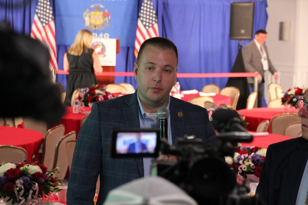 Rep. Nik Rettinger, R-Mukwonago, speaks to reporters at the Republican National Convention on July 17, 2024. Shawn Johnson/WPR