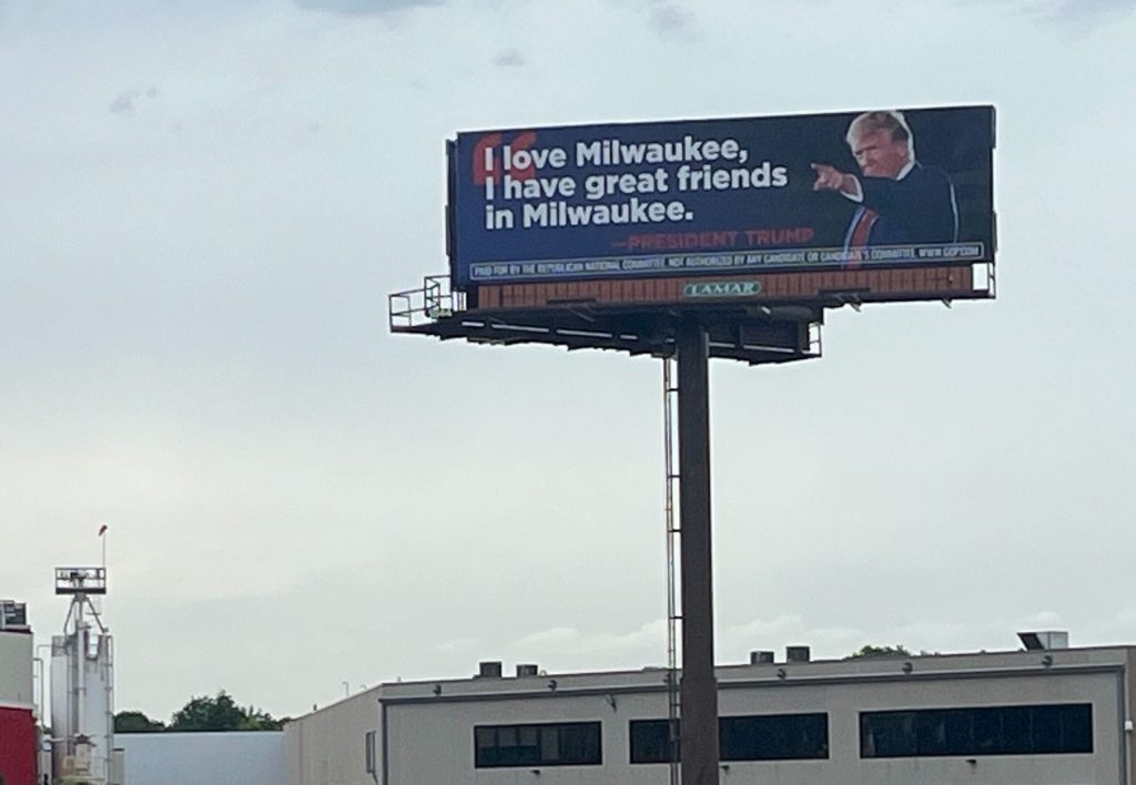 A billboard supporting former President Donald Trump stands off the highway in downtown Milwaukee, near the Fiserv Forum which will host the upcoming Republican National Convention, on July 3, 2024. Deneen Smith/WPR