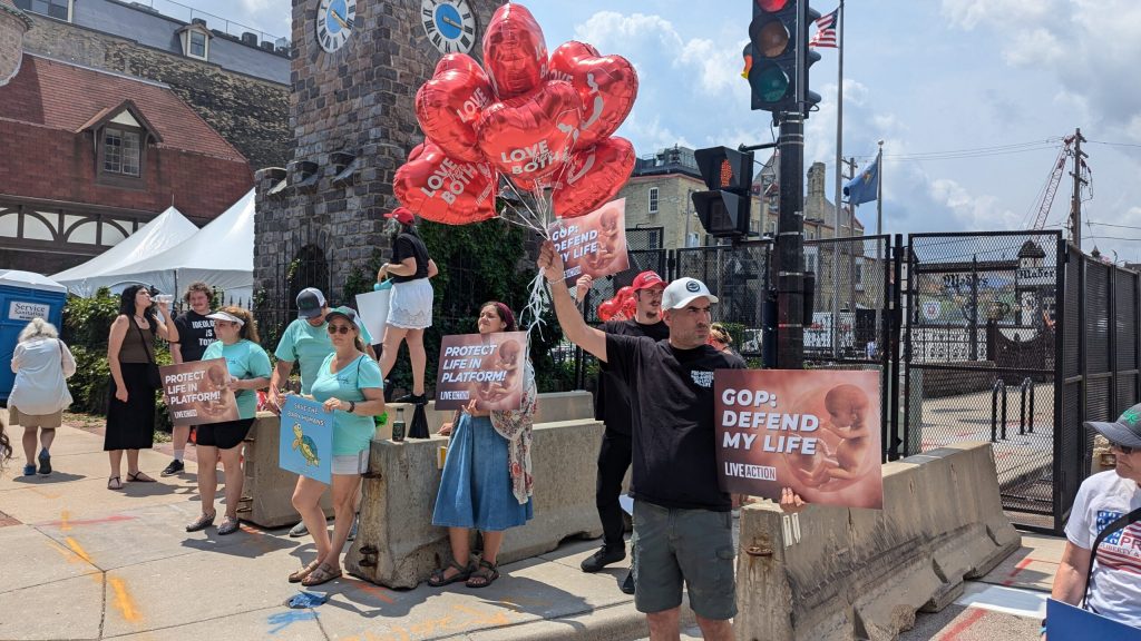 Anti-abortion protesters outside the security fence around the RNC. (Baylor Spears | Wisconsin Examiner)
