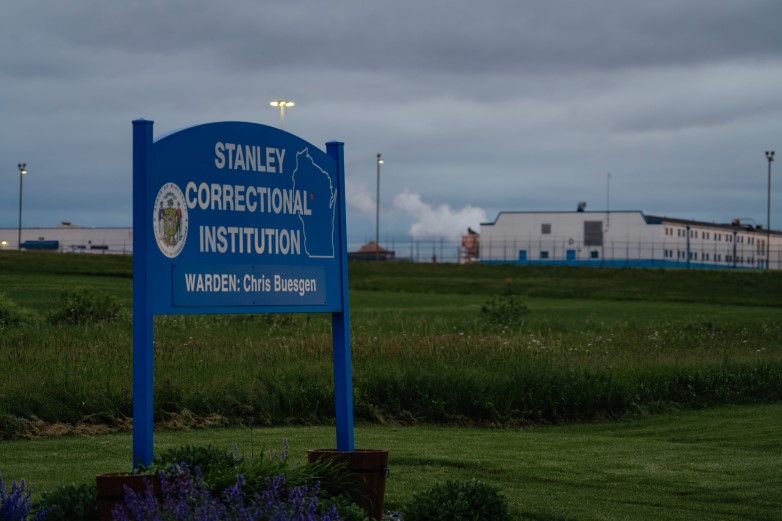A sign sits outside the medium-security Stanley Correctional Institution on June 9, 2024, in Stanley, Wis. Nearly a third of the 60 staff physicians Wisconsin’s corrections system has employed over the past decade have been censured by a state medical board for an error or a breach of ethics. (Jamie Kelter Davis for The New York Times)