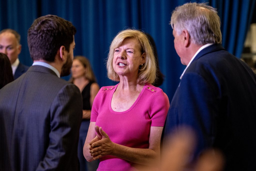 Sen. Tammy Baldwin mingles before speaking ahead of Vice President Kamala Harris on Thursday, Aug. 3, 2023, at Sanmina in Pleasant Prairie, Wis. Angela Major/WPR