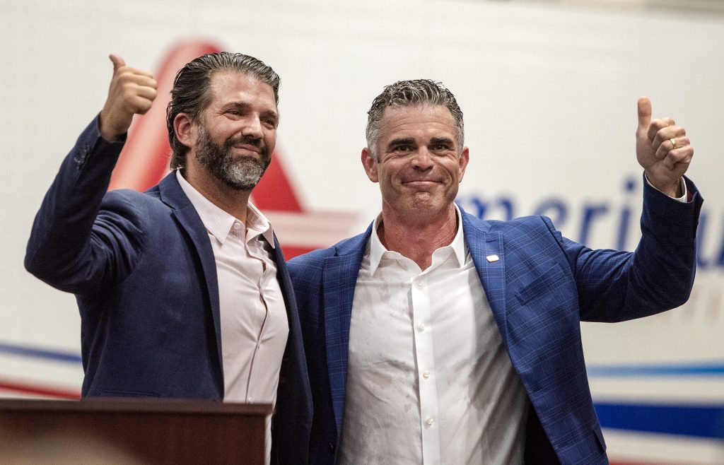 Donald Trump Jr., left, stands with Republican congressional candidate Tony Wied, right, after a campaign event Tuesday, June 4, 2024, in De Pere, Wis. Angela Major/WPR
