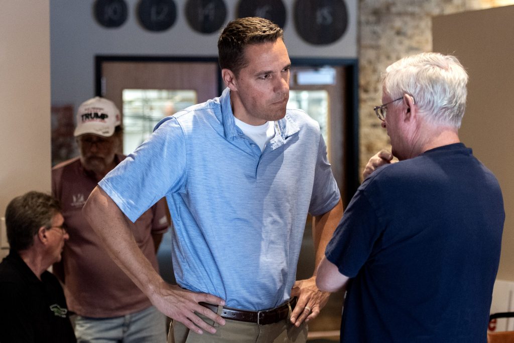 Roger Roth, a Republican candidate in the eighth congressional district, speaks to a supporter during a campaign event Wednesday, July 10, 2024, in Green Bay, Wis. Angela Major/WPR