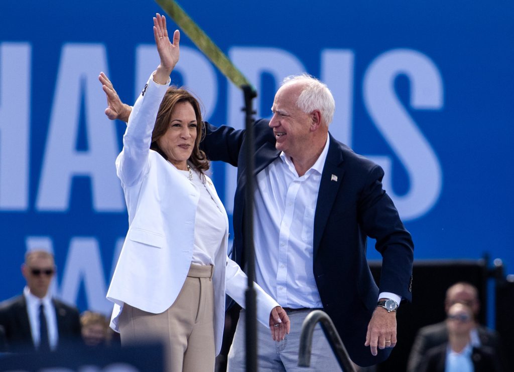 Vice President Kamala Harris stands with her running mate, Tim Walz, during a rally for her campaign for president Wednesday, Aug. 7, 2024, in Eau Claire, Wis. Angela Major/WPR