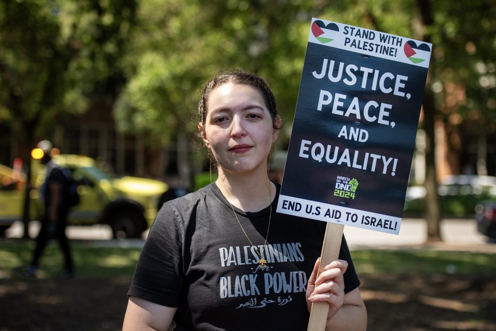 Heba Mohammad of Milwaukee holds her sign during a pro-Palestinian protest in response to the Democratic National Convention on Monday, Aug. 19, 2024, in Chicago, Ill. Angela Major/WPR