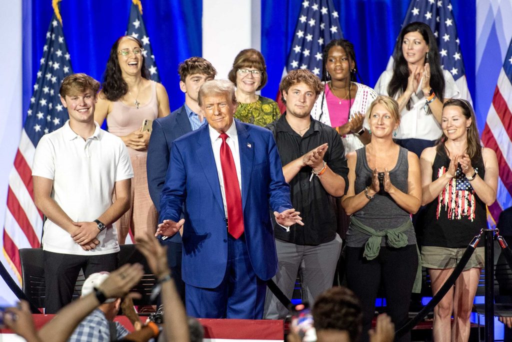 Former President Donald Trump speaks at a town hall Thursday, Aug. 29, 2024, at the La Crosse Center in La Crosse, Wis. He took questions from the people pictured here behind him. Angela Major/WPR