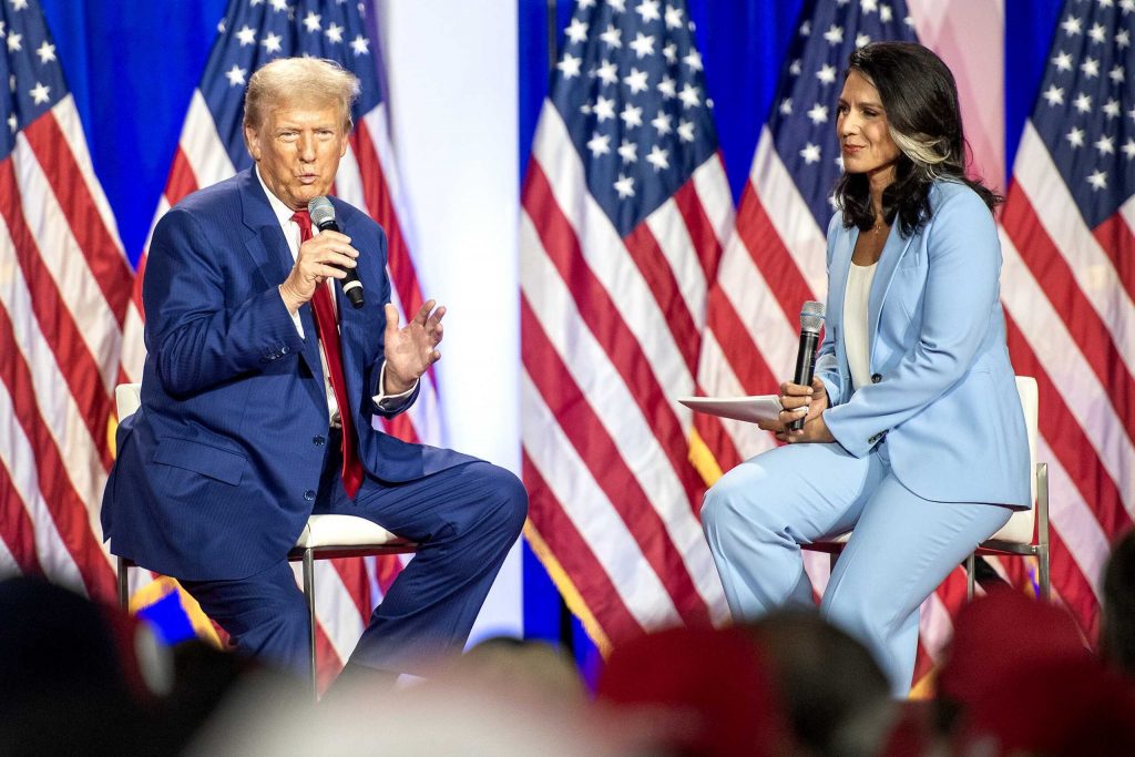 Former President Donald Trump speaks with former U.S. Rep. Tulsi Gabbard at a campaign rally on Aug. 29, 2024 at the La Crosse Center in La Crosse, Wis. Angela Major/WPR