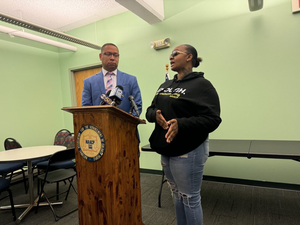 Attorney William Sulton (left) and DeAsia Harmon speak at a press conference on Tuesday, Aug. 6, 2024. Evan Casey/WPR