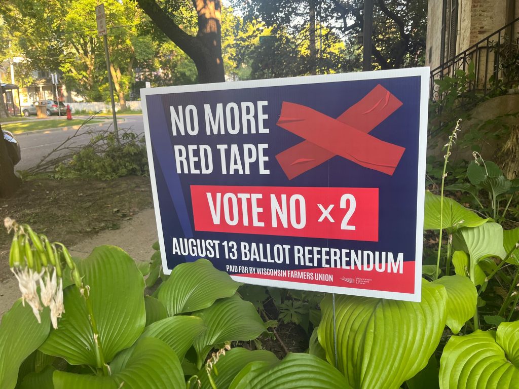 A yard sign urges a no vote for two constitutional amendment questions on Tuesday’s primary ballot. Matthew DeFour / Wisconsin Watch