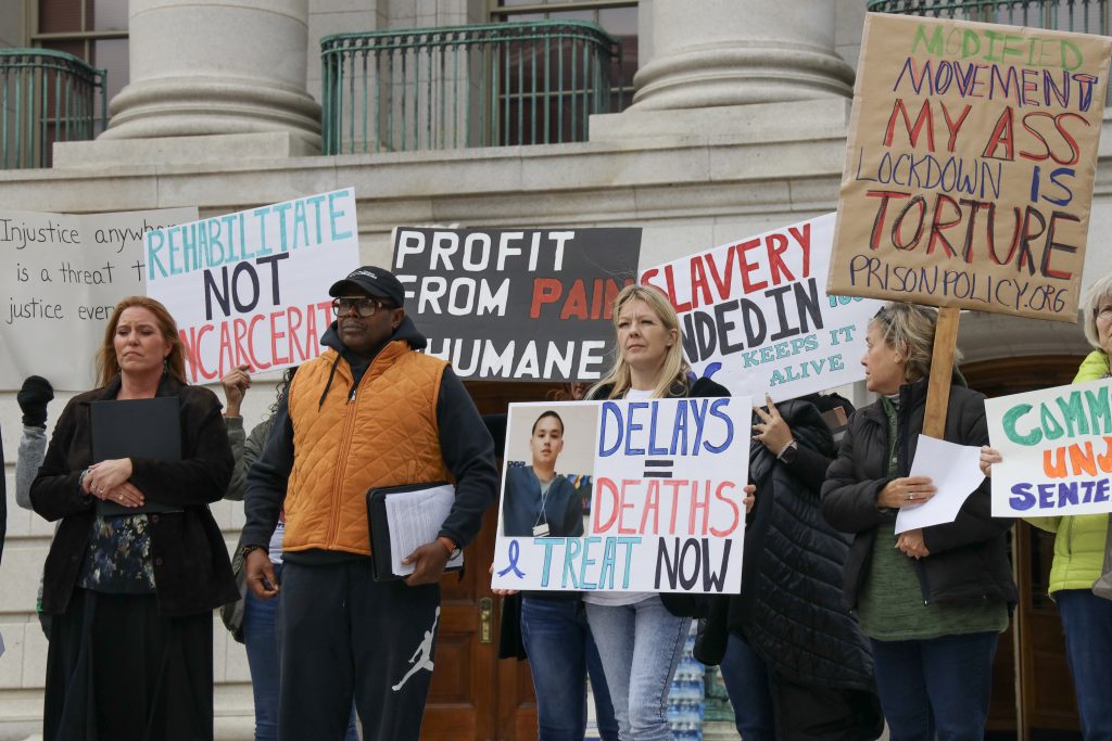 Protesters call on the short-staffed Wisconsin Department of Corrections to improve prisoner conditions and lift restrictions on prisoners’ movement during a protest at the Wisconsin State Capitol on Oct. 10, 2023, in Madison, Wis. (Meryl Hubbard / Wisconsin Watch)