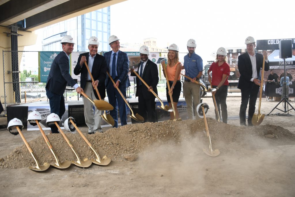 Matt Dorner (left) and Paul Schwartz (far right) break ground on the Downtown Dog Park. Photo by Jeramey Jannene.