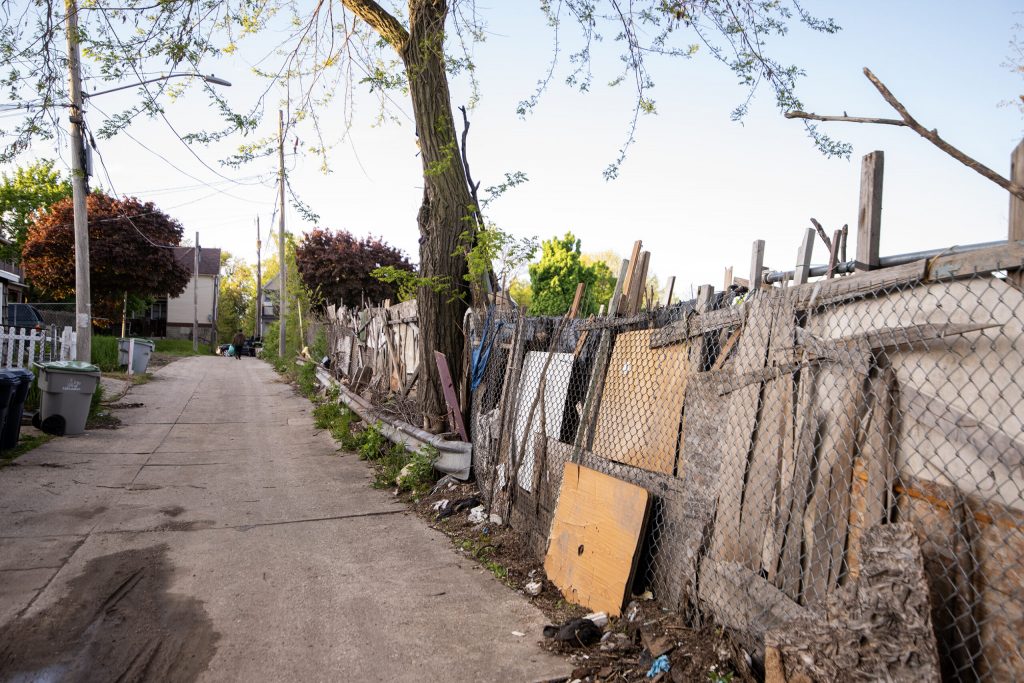 A fence surrounds an outdoor encampment Thursday, May 9, 2024, in Milwaukee, Wis. Angela Major/WPR