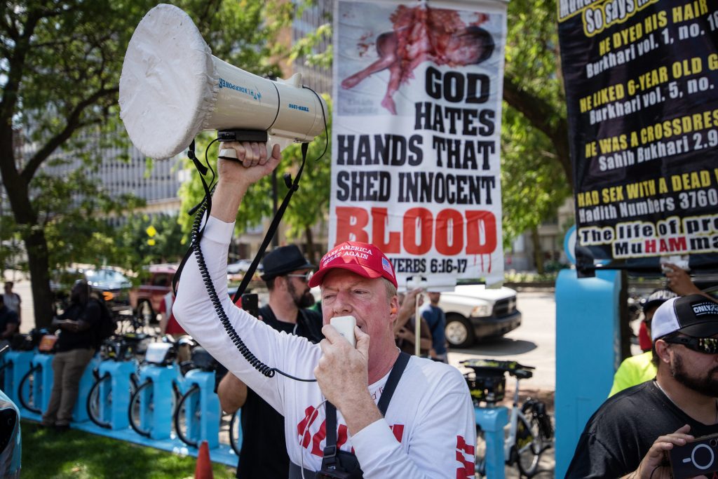 An anti-abortion protest group directs chants at the anti-Trump protest gathered in Red Arrow Park during the first day of the RNC on Monday, July 15, 2024, in Milwaukee, Wis. Angela Major/WPR