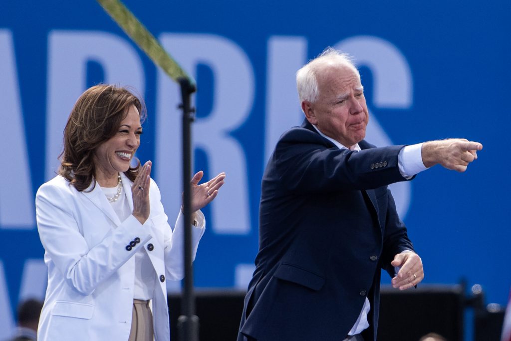 Vice President and Democratic candidate for president Kamala Harris and her running mate, Gov. Tim Walz, stand together on stage during a rally Wednesday, Aug. 7, 2024, in Eau Claire, Wis. Angela Major/WPR