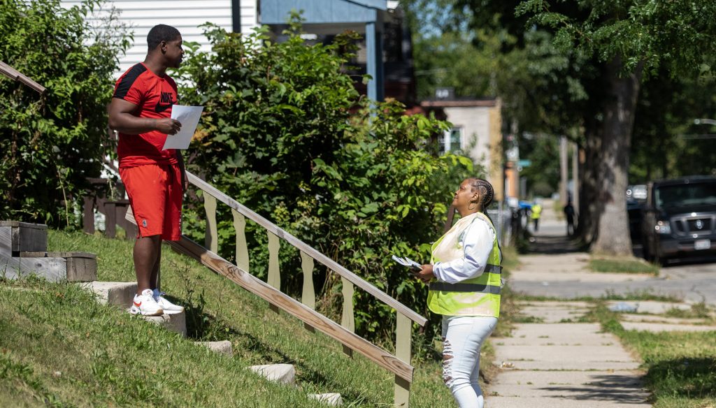 Marketta Weddle, right, speaks to a potential voter while knocking doors Tuesday, Sept. 3, 2024, in Milwaukee, Wis. Angela Major/WPR