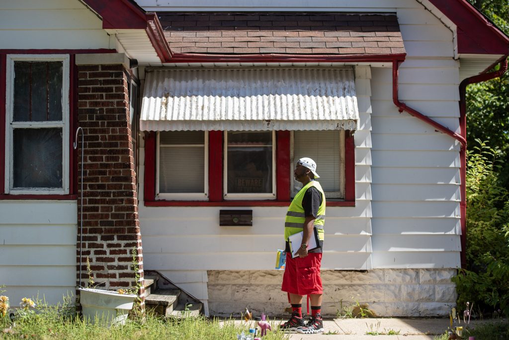 Broshea Jackson knocks on a door in a Milwaukee neighborhood in an effort to communicate with voters Tuesday, Sept. 3, 2024. Angela Major/WPR