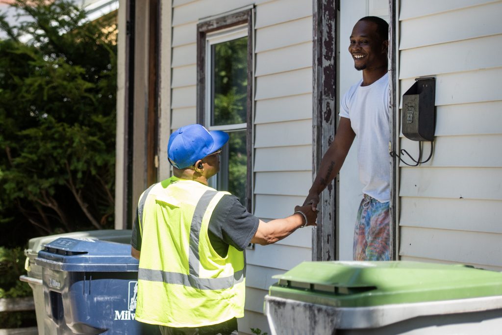 Volunteers knock on doors in a Milwaukee neighborhood in an effort to reach voters Tuesday, Sept. 3, 2024. Angela Major/WPR