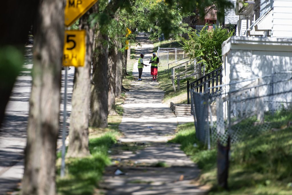 Volunteers walk through a Milwaukee neighborhood to communicate with potential voters Tuesday, Sept. 3, 2024. Angela Major/WPR